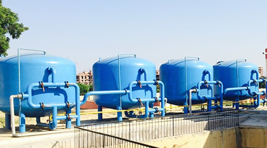Pressure sand filter for water and wastewater treatment